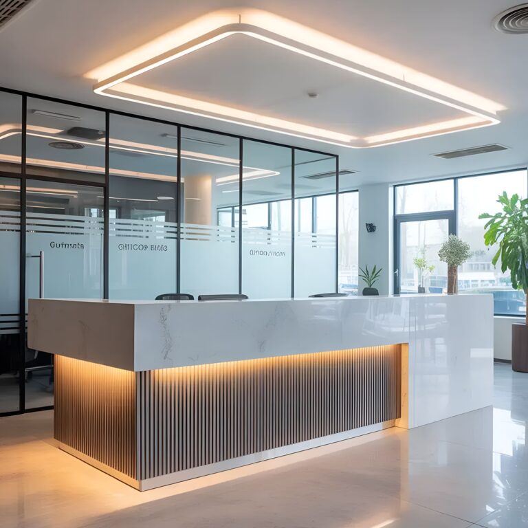 Modern open-plan office in Dubai featuring glass partitions, warm ceiling lights, and a sleek wooden reception desk
